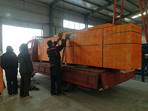 Shaftless screw conveyor loading and delivery site